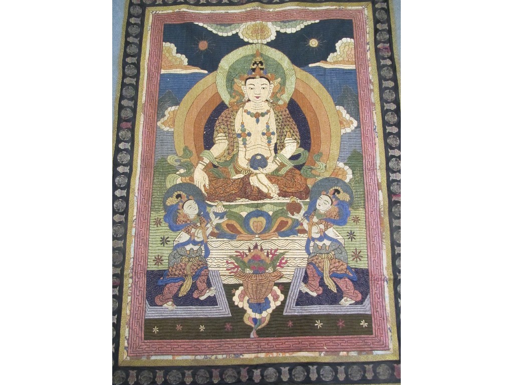 Appraisal: A Buddhist silk embroidered wall hanging Buddha before the earth