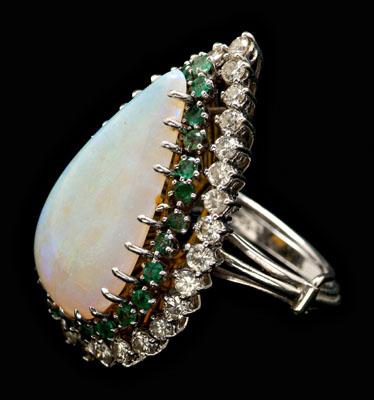 Appraisal: Opal emerald diamond ring central pear-shaped cabochon opal estimated weight