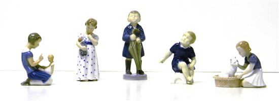 Appraisal: Five porcelain figures of children boy holding an umbrella on