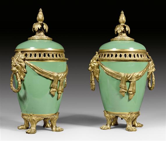 Appraisal: PAIR OF LIDDED VASES AUX TETES DE LIONS WITH BRONZE