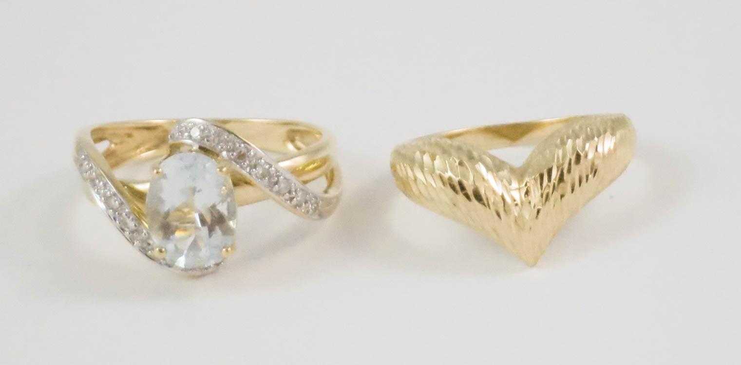 Appraisal: TWO FOURTEEN KARAT YELLOW GOLD RINGS including a size ring