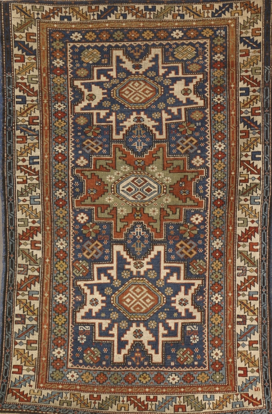 Appraisal: Caucasian Rug First Quarter th Century Blue ground with rosette