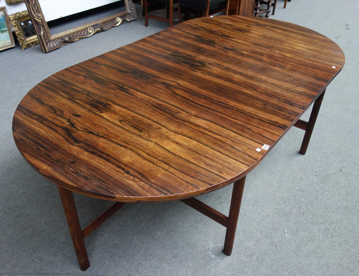 Appraisal: Archie Shine a mid th century rosewood circular extending dining