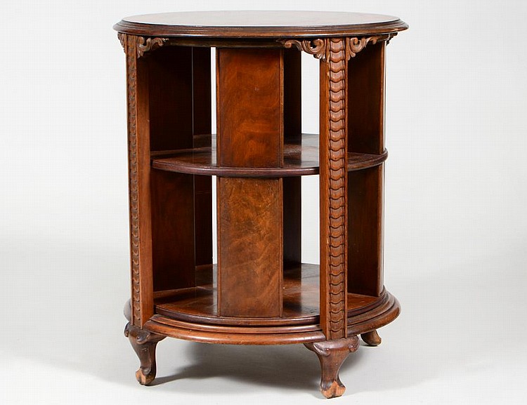 Appraisal: WALNUT REVOLVING LIBRARY BOOK TABLEThe circular top with a molded