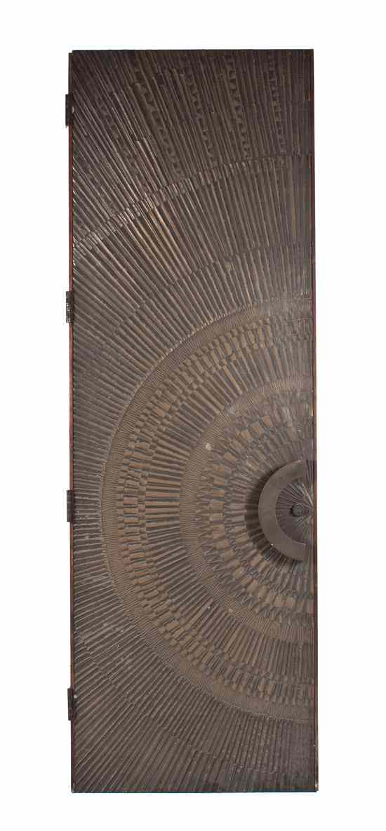 Appraisal: An Art Deco Carved Hardwood Door having linear decoration radiating