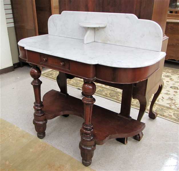 Appraisal: A VICTORIAN MAHOGANY MARBLE-TOP WASHSTAND English last quarter of the