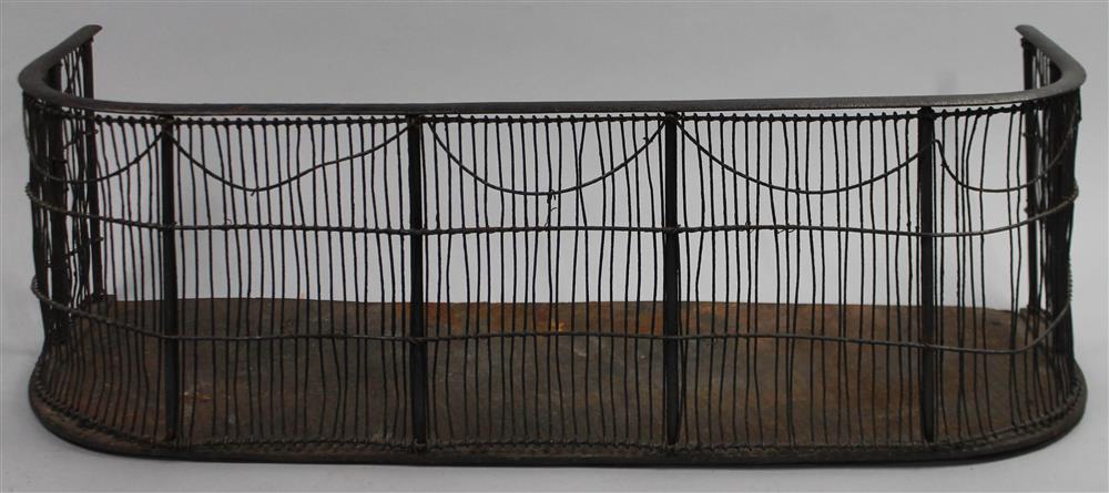 Appraisal: EARLY NINETEENTH CENTURY IRON WIREWORK FIRE FENDER front applied with