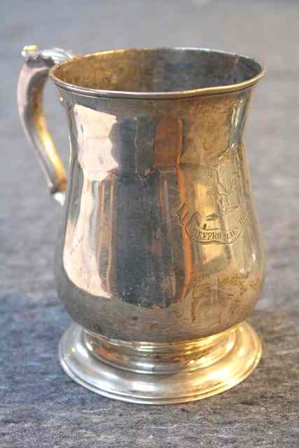 Appraisal: A GEORGE III BALUSTER SHAPED SILVER TANKARD with turned stepped