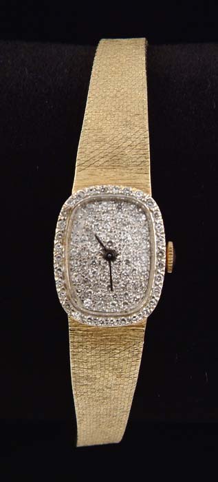 Appraisal: DIAMOND AND K YELLOW GOLD LADIES WRISTWATCH Watch face is