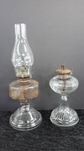 Appraisal: Antique Clear Glass Kerosene Oil Lamps One is paneled flint