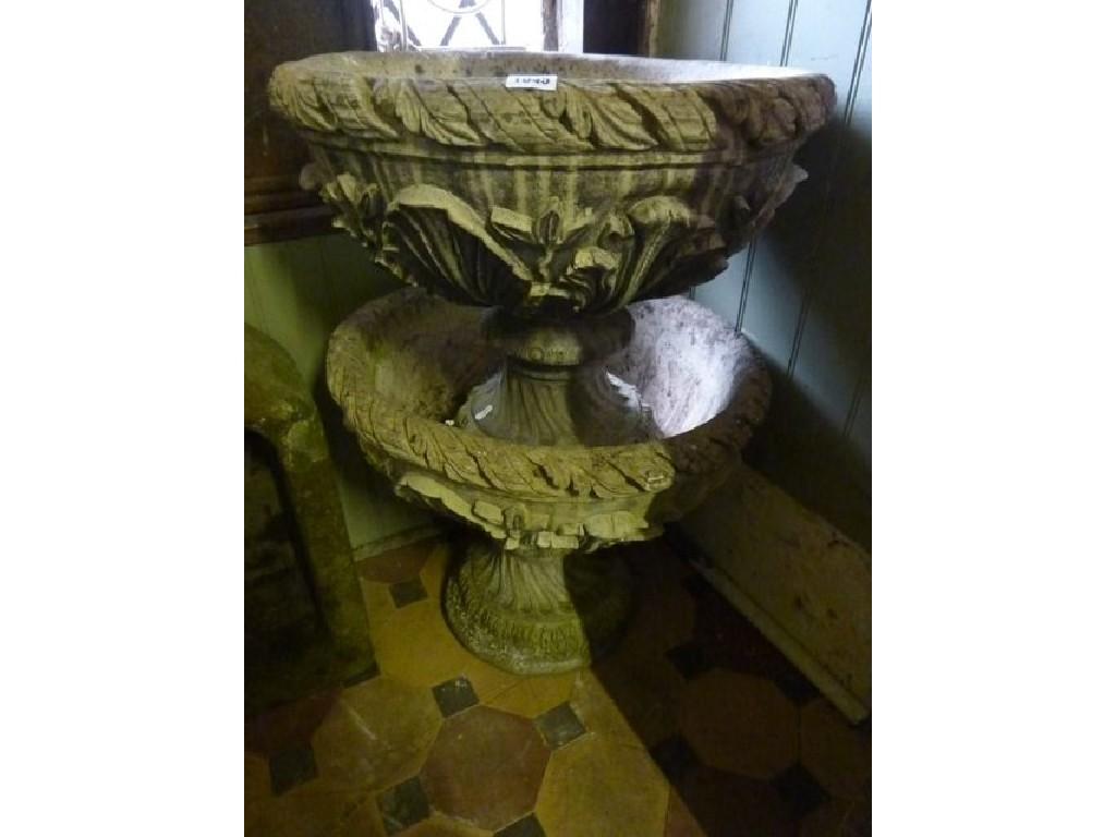 Appraisal: A pair of weathered composition stone garden urns of circular