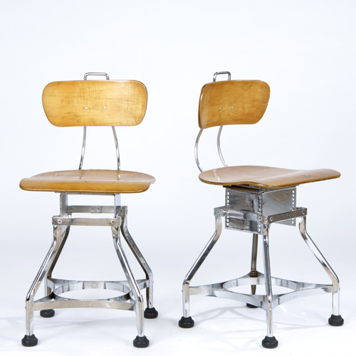 Appraisal: Pair of laminated plywood desk chairs on industrial chrome bases