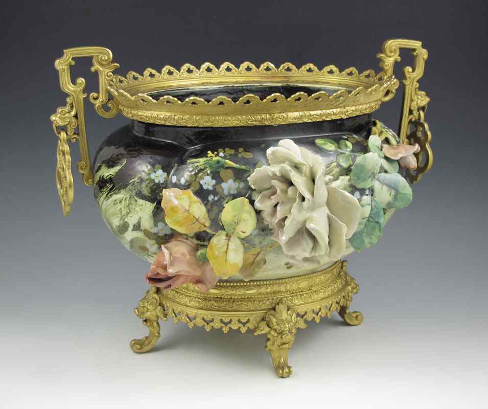 Appraisal: CINCINNATI LIMOGES TYPE CERAMIC CENTER BOWL Ormolu mounted applied flowers