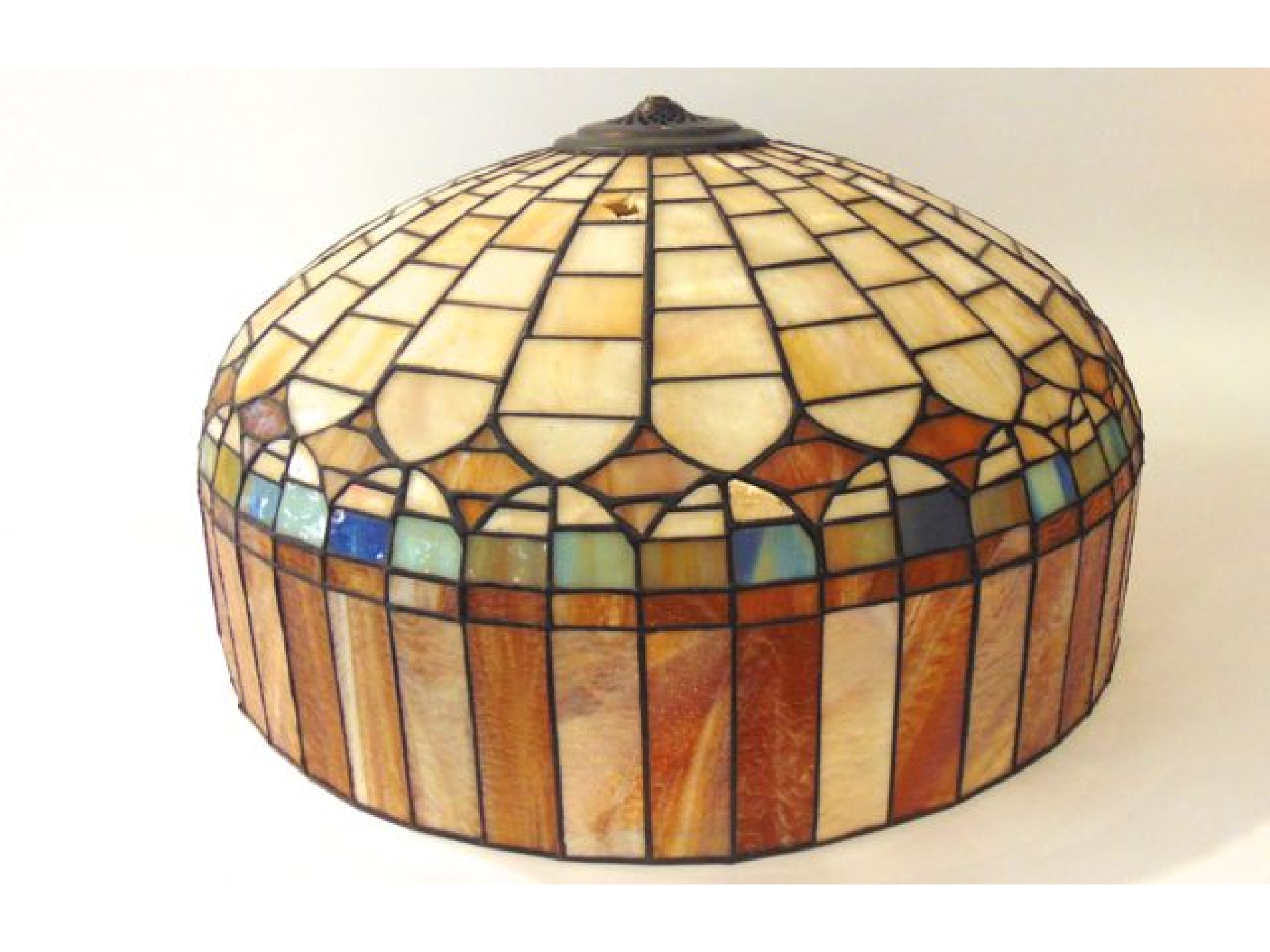 Appraisal: A substantial ceiling light shade composed in leaded glass panels