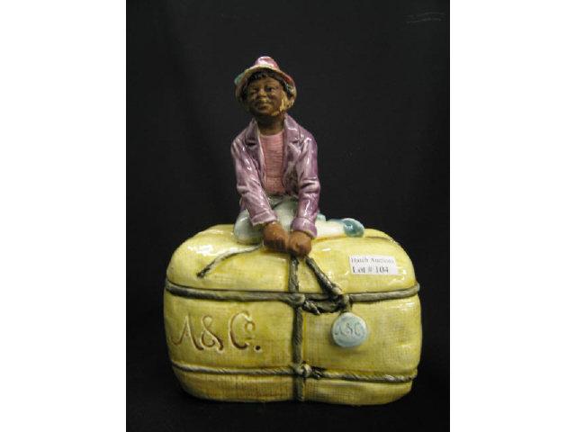 Appraisal: Black Americana Figural Majolica Tobacco Jar boy on top of