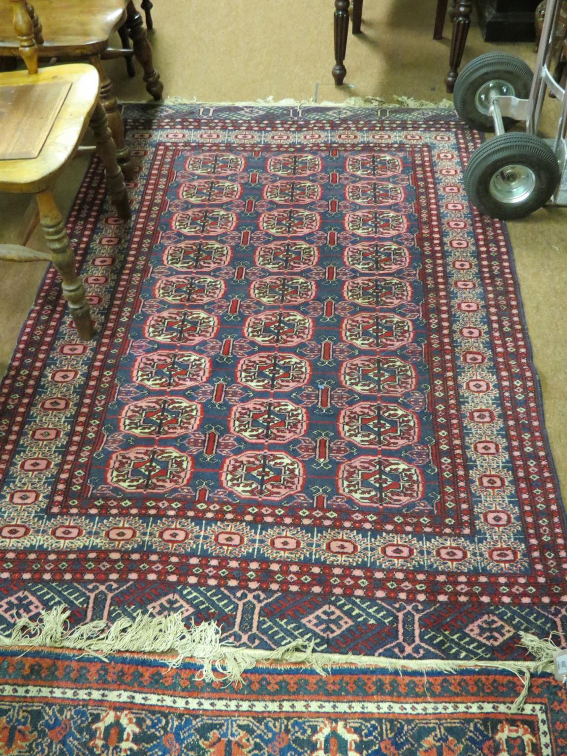 Appraisal: Three Eastern wool rugs predominantly red geometric patterns largest ft