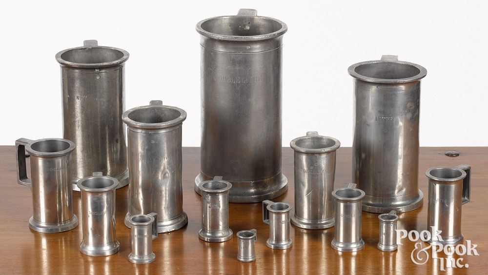 Appraisal: Fourteen graduated French pewter measures Fourteen graduated French pewter measures