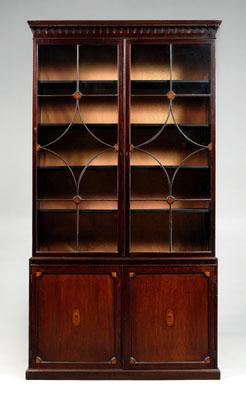 Appraisal: Chippendale mahogany breakfront two-case construction upper case with two finely