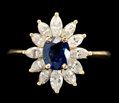 Appraisal: Sapphire diamond ring central oval-cut cornflower blue sapphire estimated weight