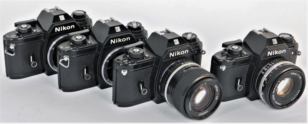 Appraisal: GROUP OF NIKON EM BLACK BODY SLR CAMERAS Group of