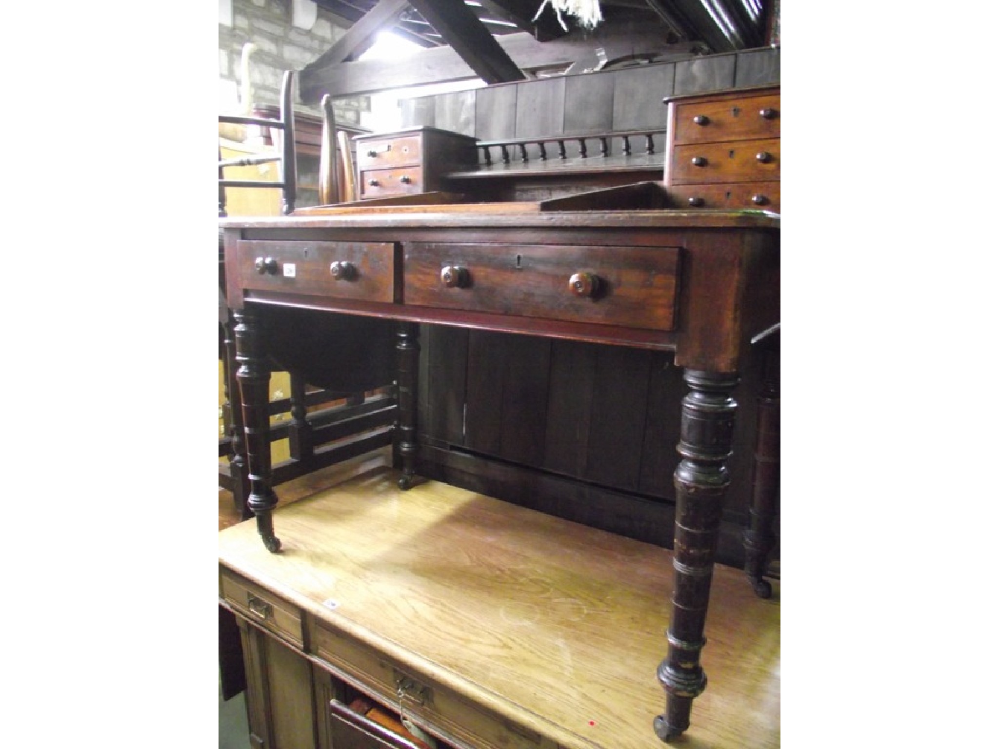 Appraisal: A Victorian walnut Dickens type desk with central shallow hinged