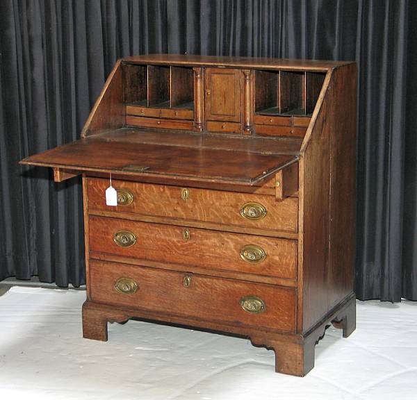 Appraisal: A George III oak slant front desk third quarter th