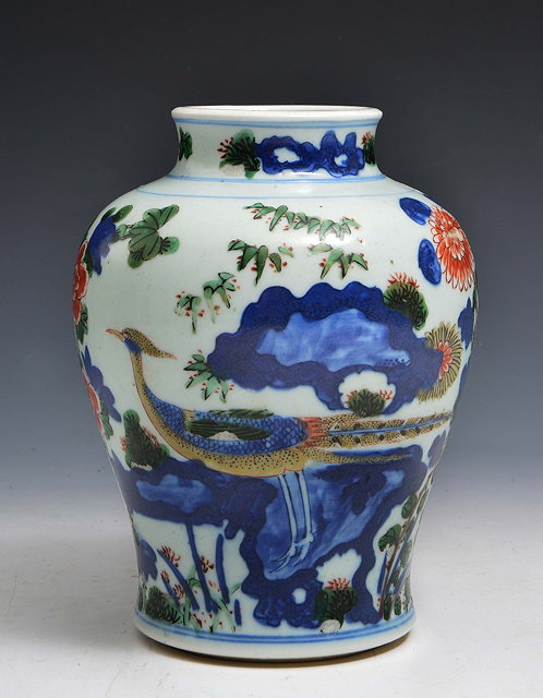 Appraisal: A CHINESE WUCAI BALUSTER FORM VASE decorated with a phoenix