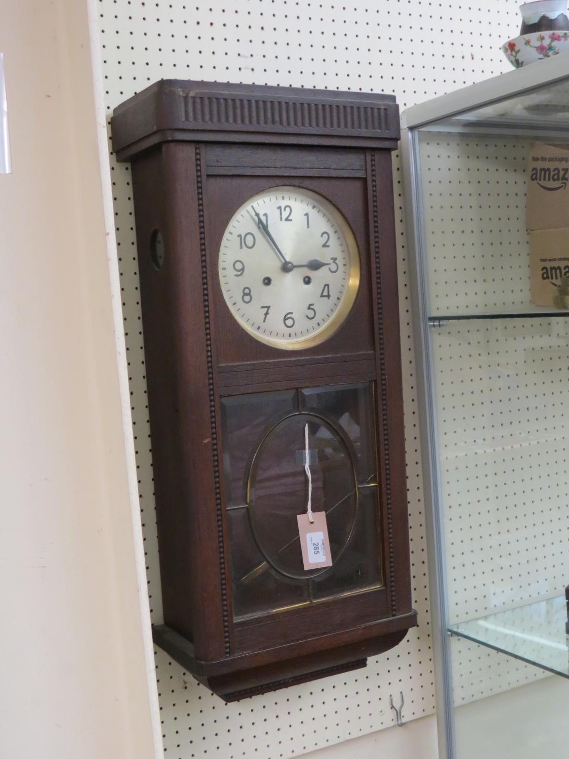 Appraisal: A 's dark oak hall clock silvered dial and gong-striking