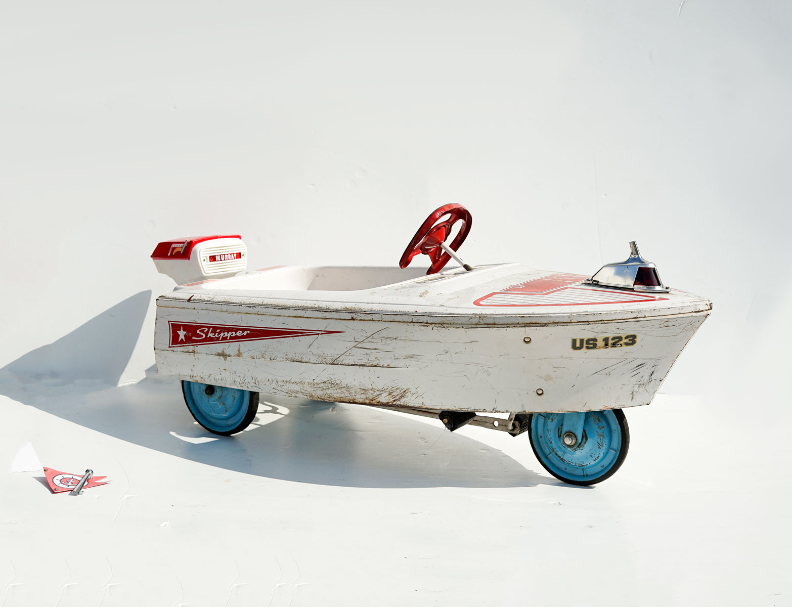 Appraisal: MURRAY ''SKIPPER'' MOTOR BOAT PEDAL CAR S Three-wheeled white and