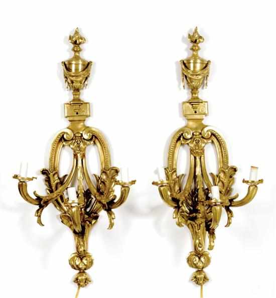 Appraisal: Pair French style brass three-light sconces urn top over pierced