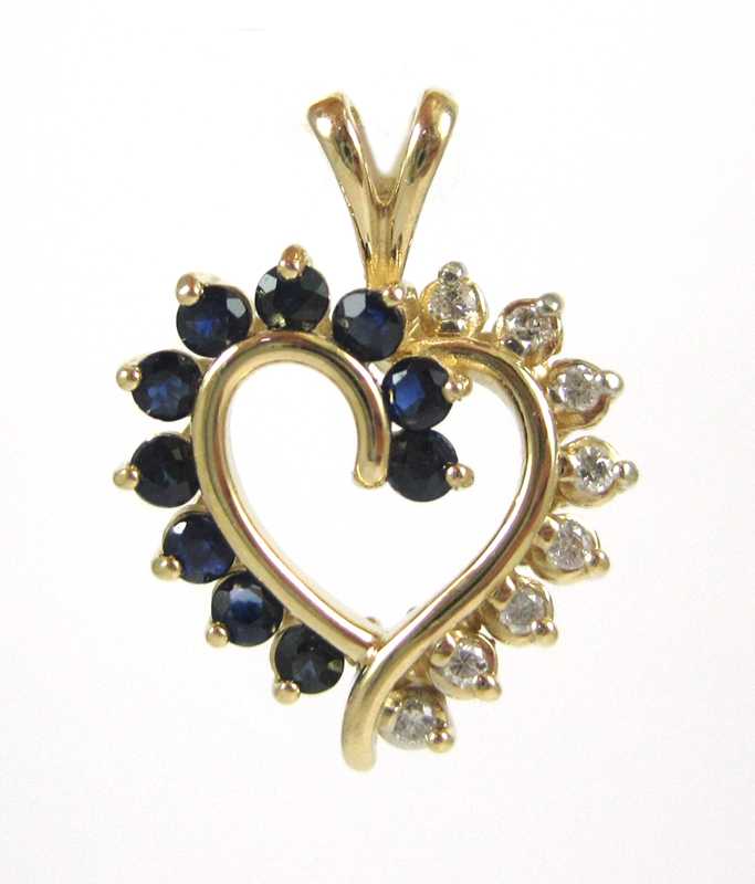 Appraisal: SAPPHIRE AND FOURTEEN KARAT GOLD PENDANT The yellow gold open