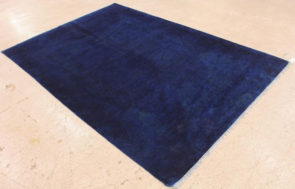 Appraisal: HAND KNOTTED MONOCHROME DECORATOR CARPET plain -tone borderless blue field