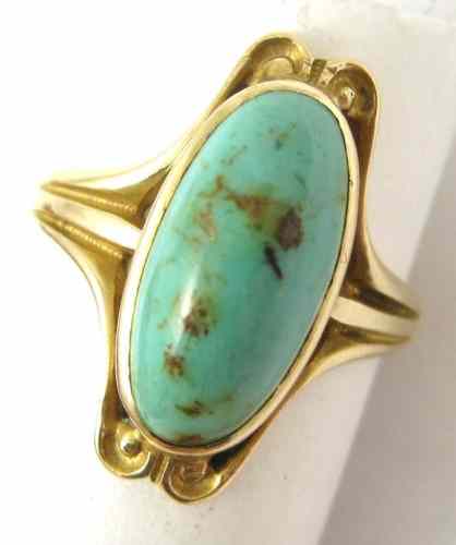 Appraisal: TURQUOISE AND FOURTEEN KARAT GOLD RING set with an oval