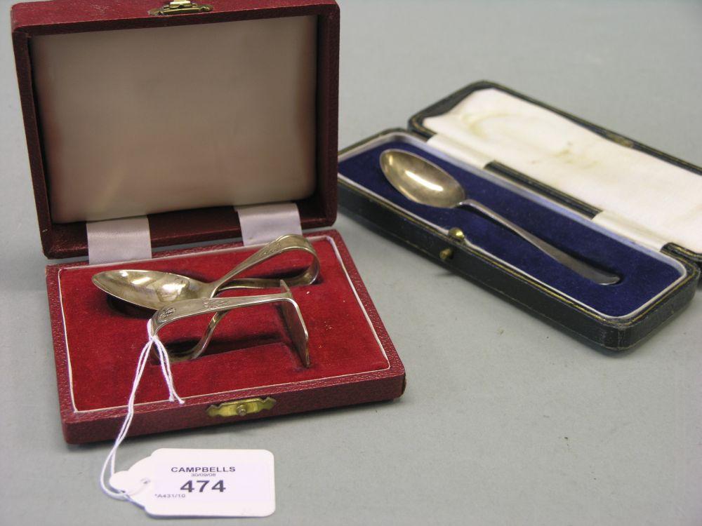 Appraisal: A cased silver christening pair consisting of spoon and scraper