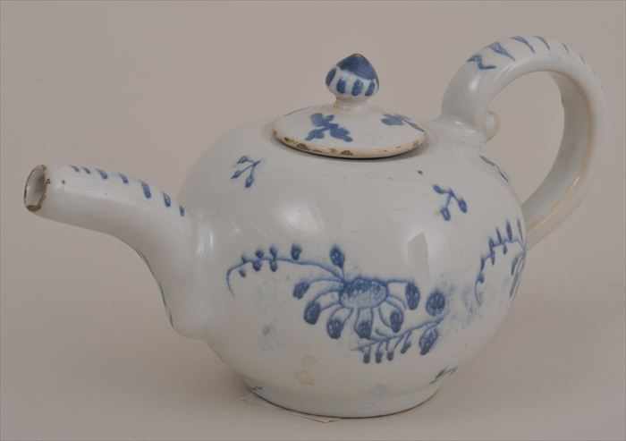 Appraisal: FRENCH FAIENCE MINIATURE TEAPOT The squat spherical bowl with blue