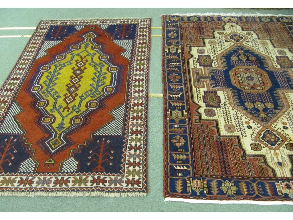 Appraisal: Two Iranian multi coloured floor rugs