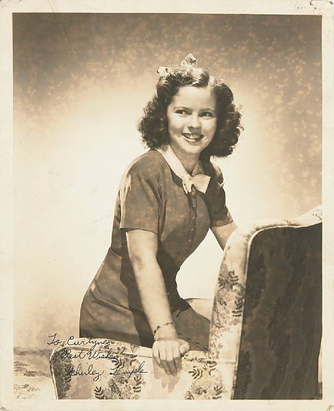 Appraisal: A Shirley Temple signed sepia photograph circa A vintage print