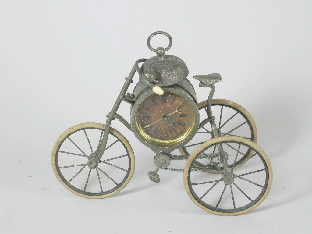 Appraisal: An Edwardian Novelty Clock modelled as a tricycle