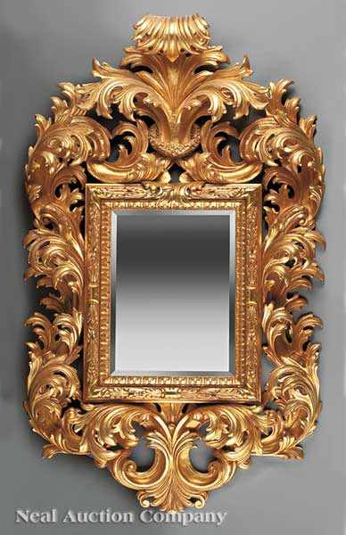 Appraisal: A Baroque-Style Carved Giltwood Mirror elaborately scrolled acanthus surround rectangular