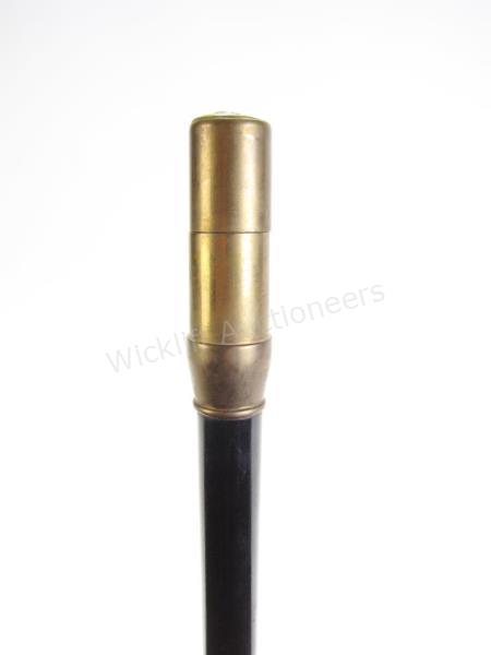 Appraisal: Brass Lighter Cane ebony shaft brass handle opens to reveal