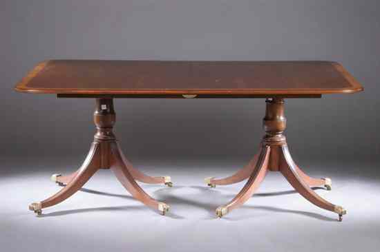 Appraisal: REGENCY STYLE MAHOGANY DOUBLE-PEDESTAL DINING TABLE Rectangular top having rounded