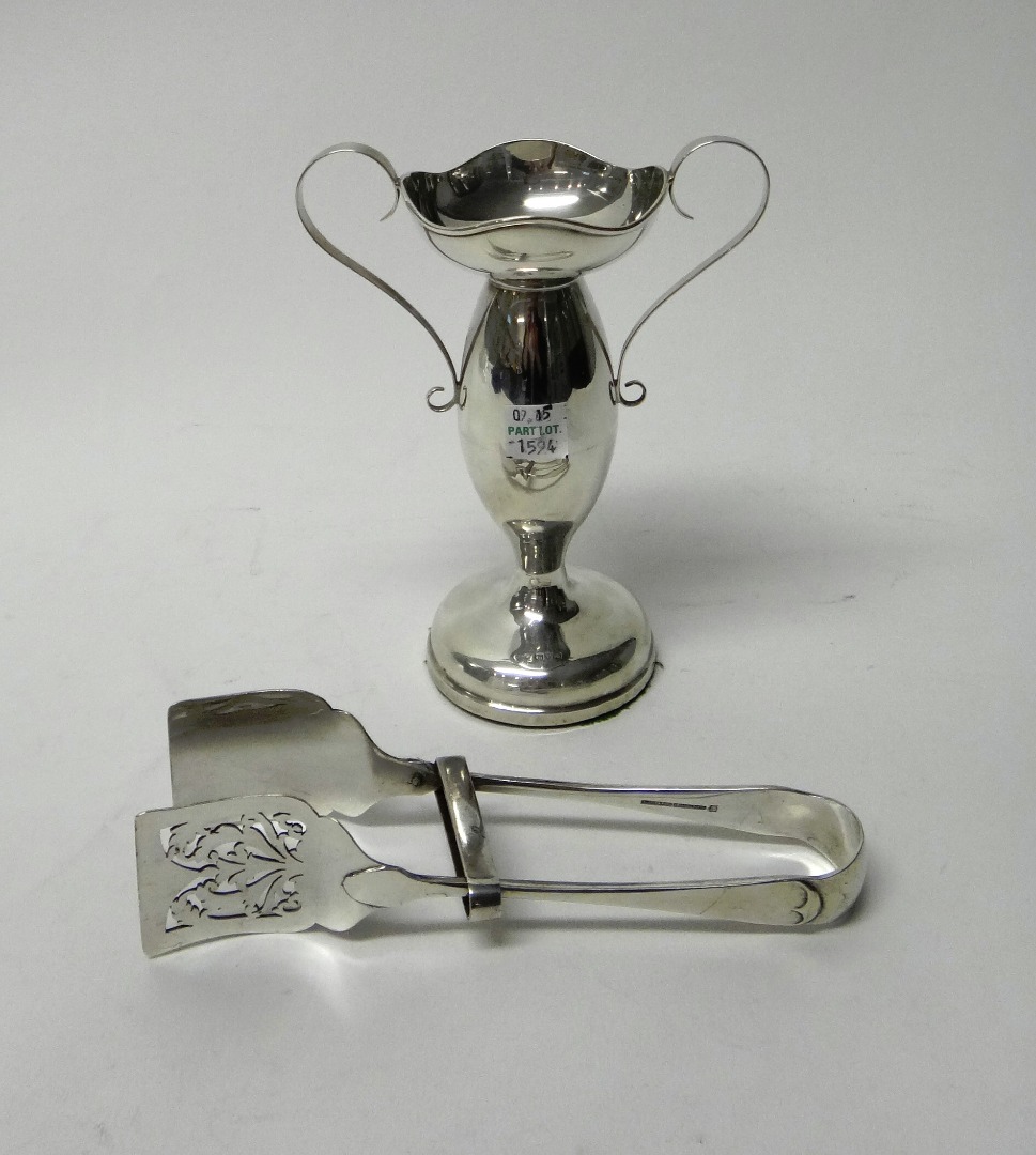 Appraisal: A silver twin handled vase with a shaped rim on