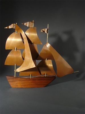 Appraisal: A Hagenauer copper and wood model of a sailing boat