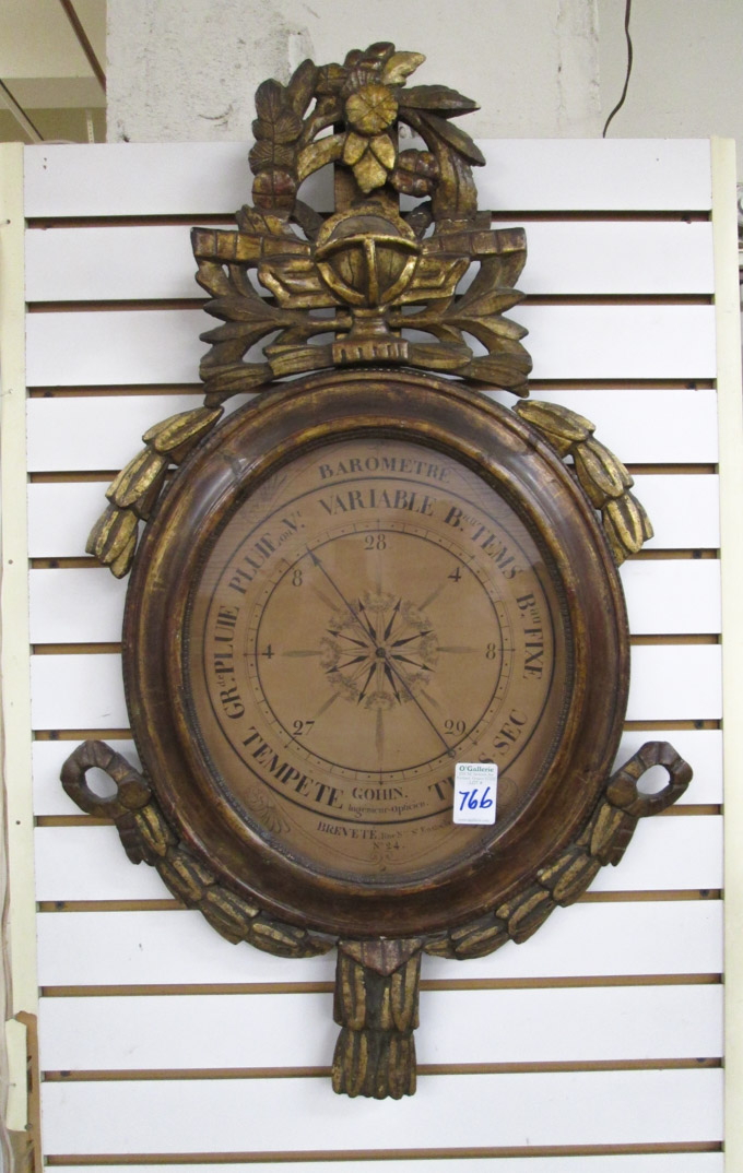 Appraisal: A ROUND GILTWOOD FRAMED WHEEL BAROMETER A Baserga Fils Paris