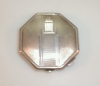 Appraisal: An Art Deco engine turned octagonal powder compact Birmingham assay