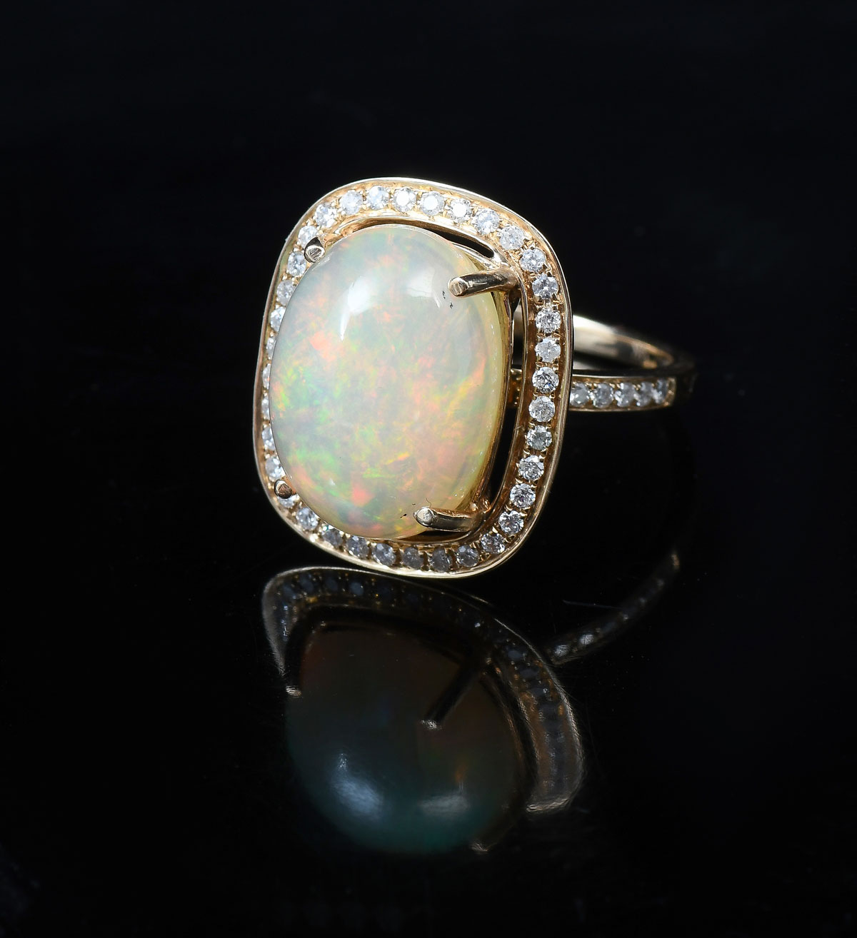 Appraisal: K OPAL DIAMOND RING K yellow gold ring features an