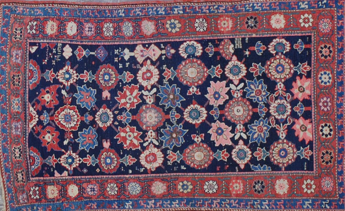 Appraisal: ANTIQUE KURDISH AREA RUG northwestern Persia dated overall floral pattern