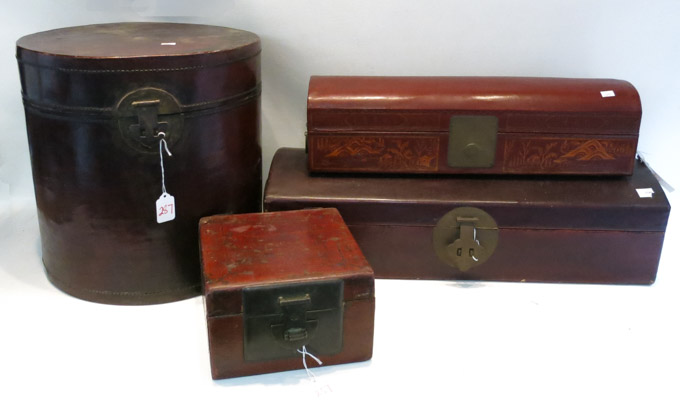 Appraisal: FOUR CHINESE LEATHER BOXES two are dome top lengths and