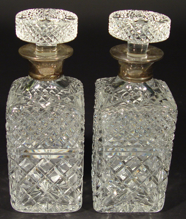 Appraisal: Pair of silver collared cut glass decanters and stoppers London