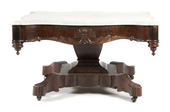 Appraisal: n American Mahogany Occasional Table the shaped marble top over